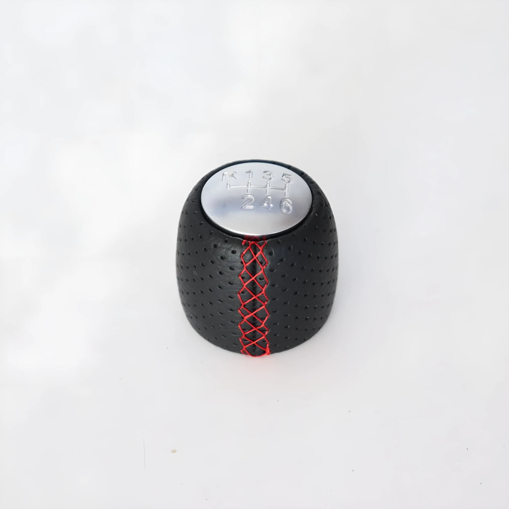 Black perforated PU leather gear knob for Alpha car with sewn seam, shown next to red and white line options.