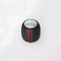 Black perforated PU leather gear knob for Alpha car with sewn seam, shown next to red and white line options.
