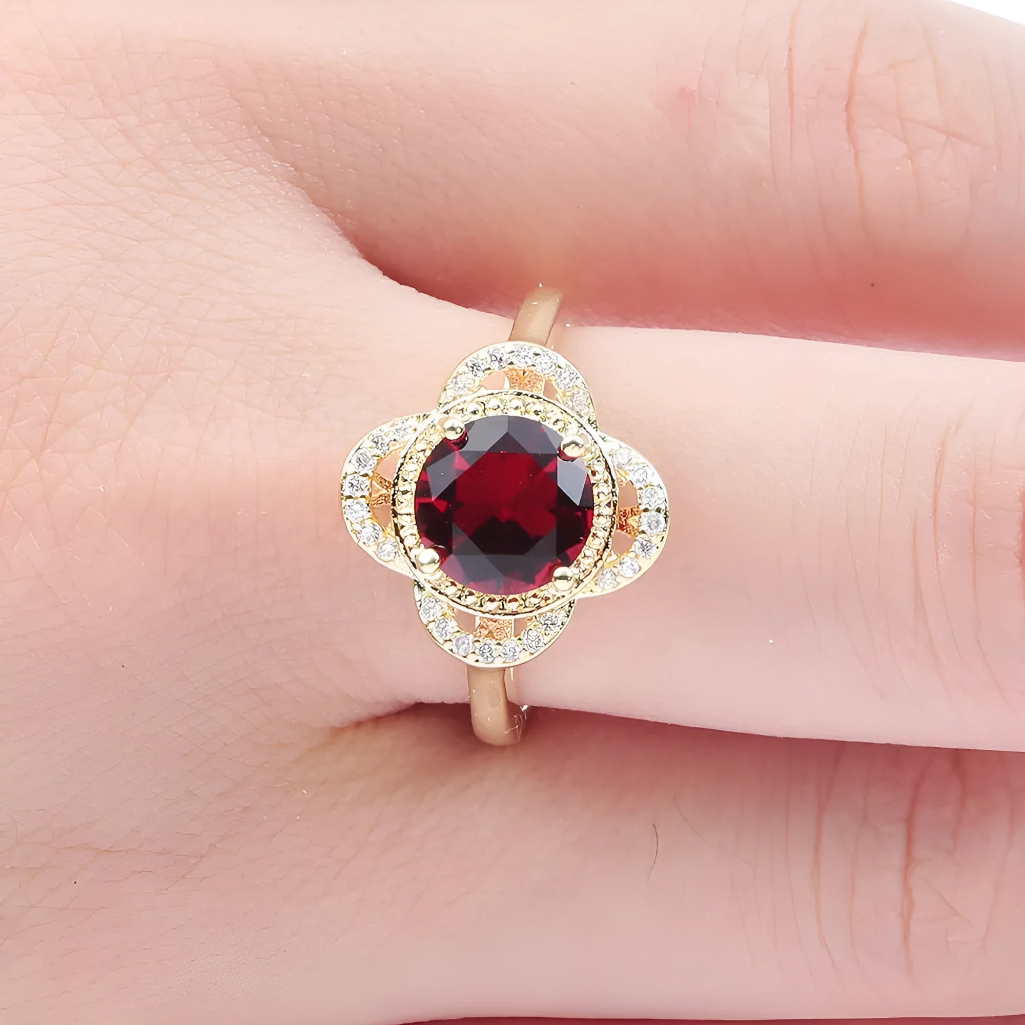 Copper ring with zircon inlay in fruit shape design on finger