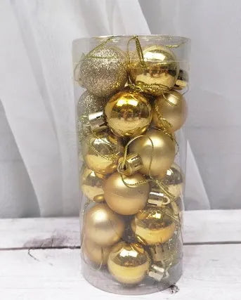 Assorted gold, red, silver and blue 3cm diameter shiny matte Christmas baubles displayed together.
