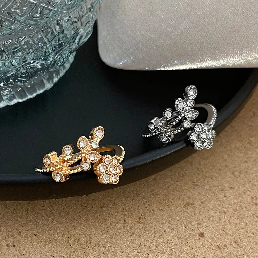 Women's open ring with diamond treatment flower leaves design in gold or white colour