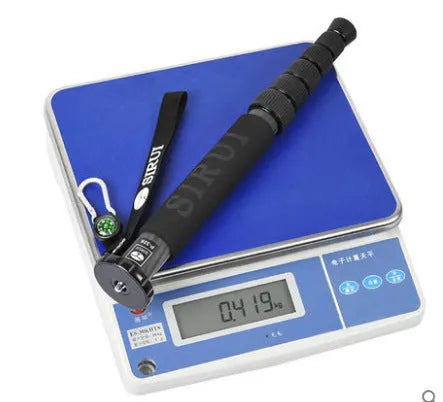 Black carbon fibre SLR camera monopod with 6 telescoping sections shown at extended height