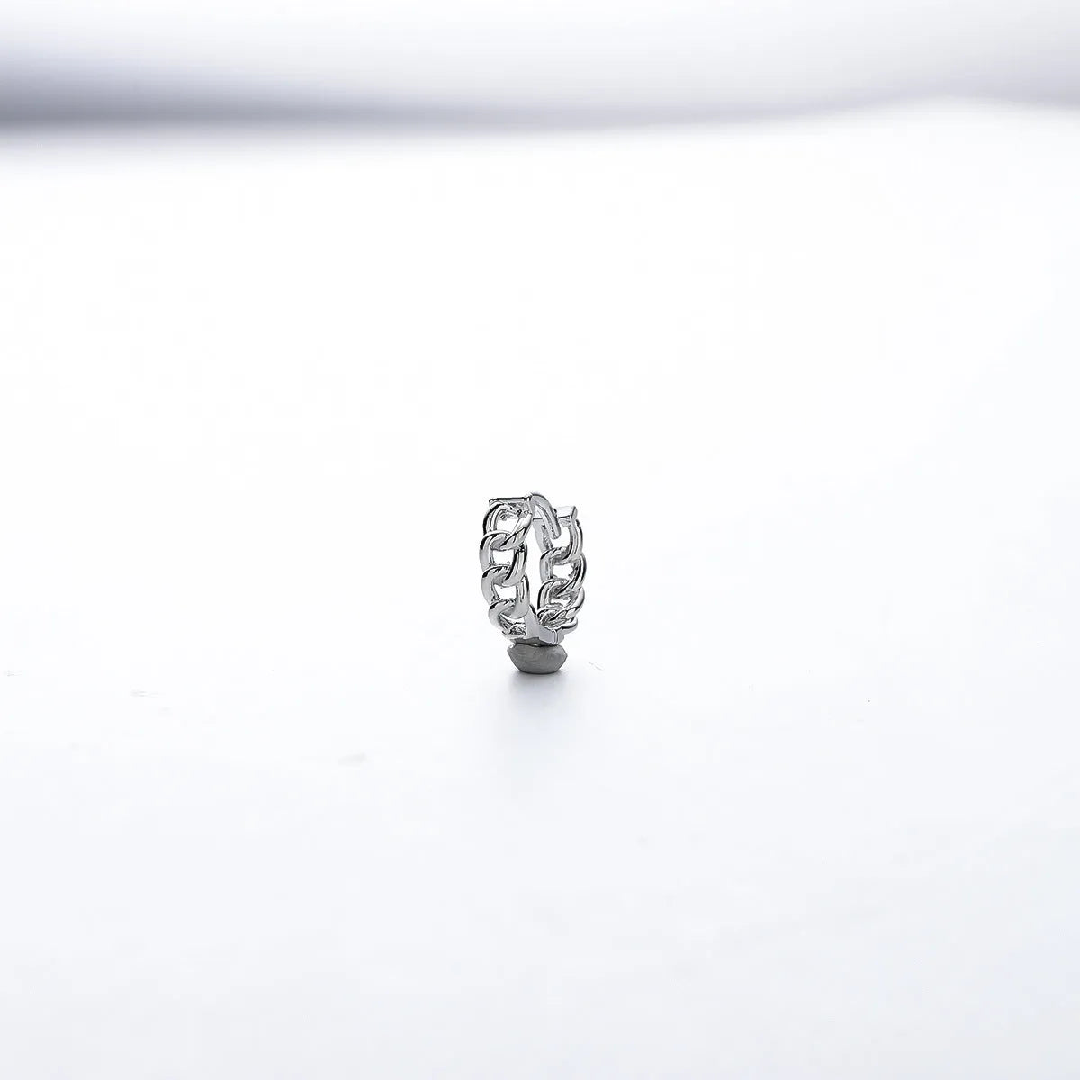 Men's silver geometric hoop earrings in 10mm and 14mm sizes on a plain background.