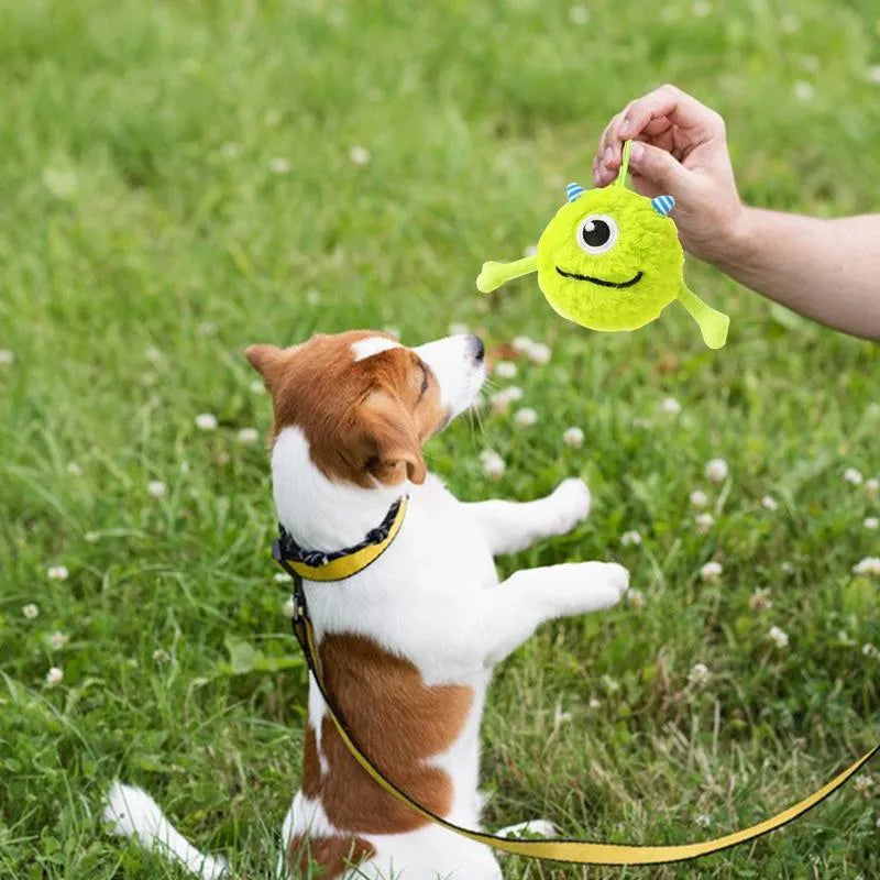 Green interactive dog toy ball with plush exterior and sound activation feature