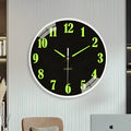 20cm modern luminous wall clock with plastic shell on a wall.