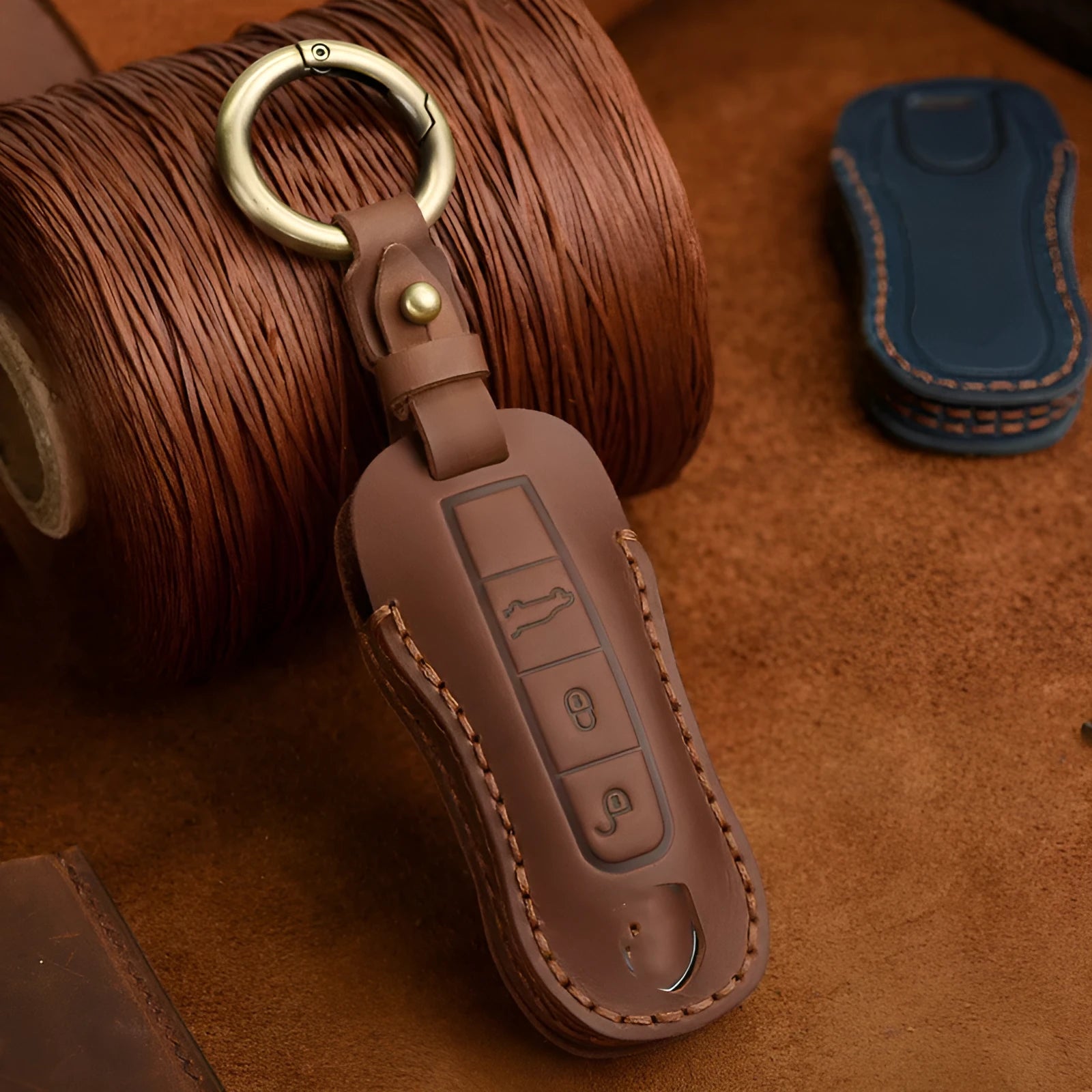 Porsche car key case made from brown cowhide leather with retro bag buckle closure