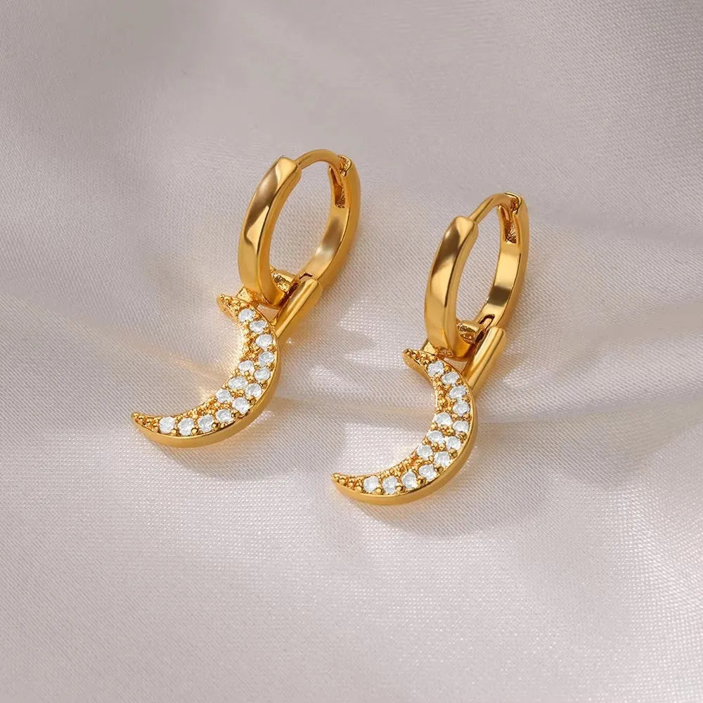 Women's copper butterfly earrings with geometric heart, star, and bow shapes and cubic zirconia stones.