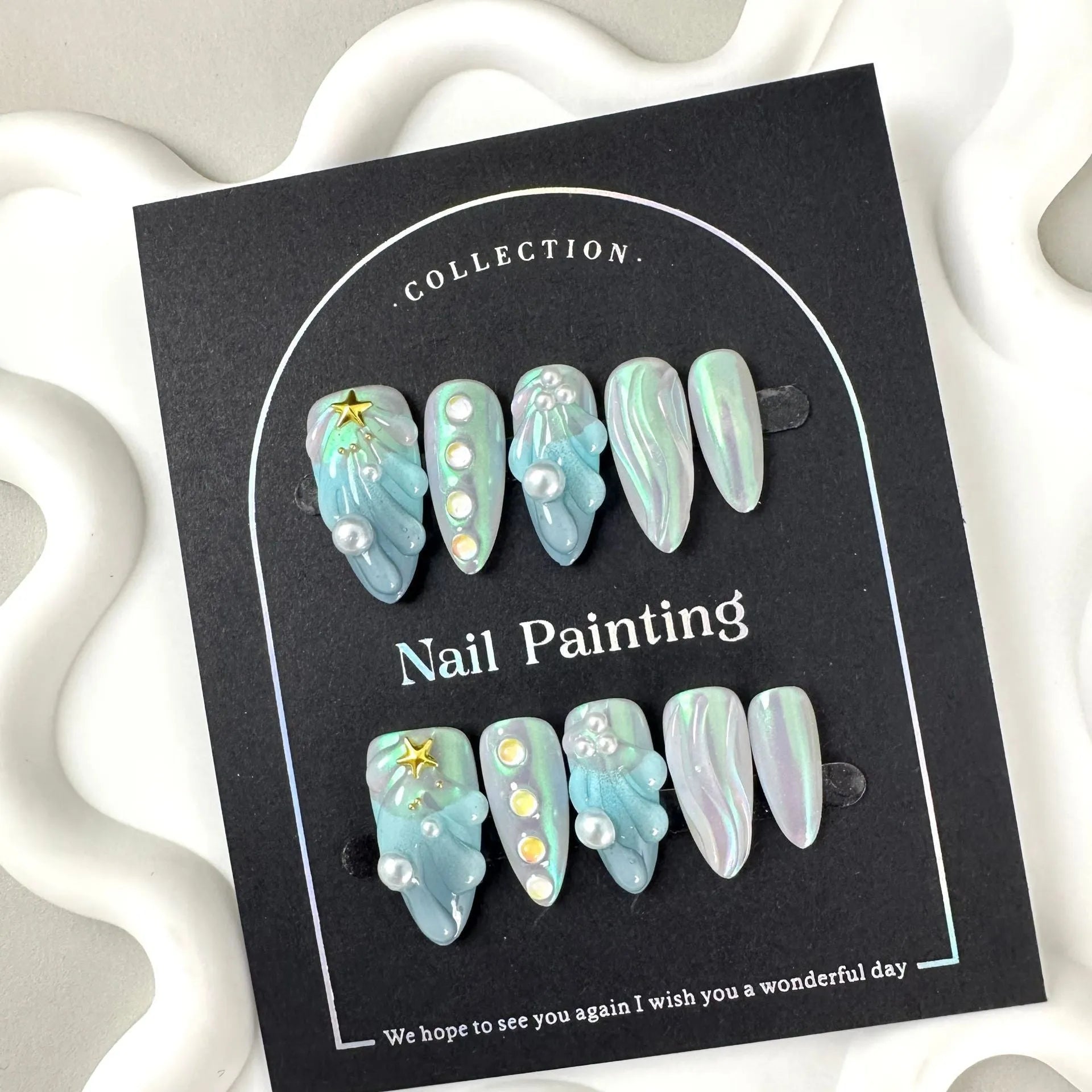 Blue plastic false nail shells for women in XS, S, M, and L sizes.