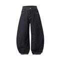 Men's wide leg denim trousers in original cow colour, showing mid waist and loose leg fit.