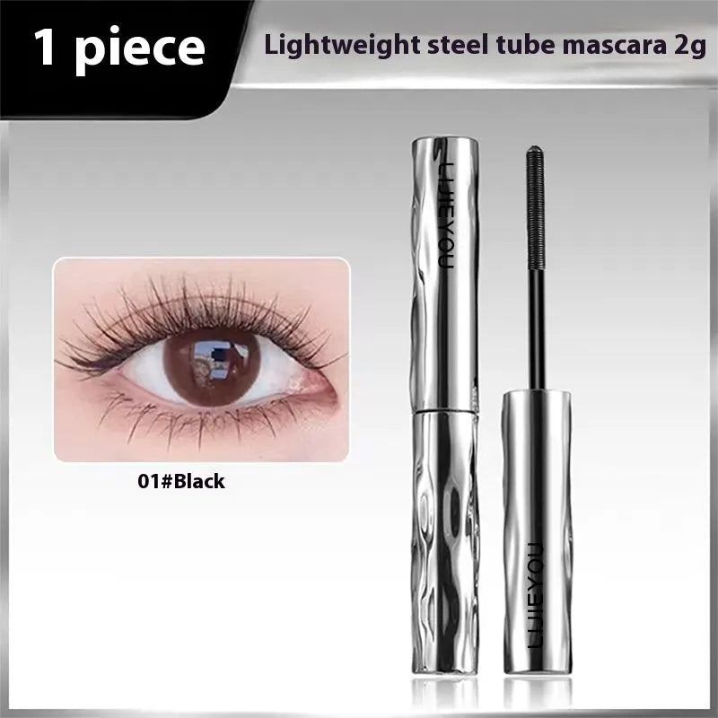 Black and brown waterproof mascara in a steel tube, shown with an optional eyelash curler.