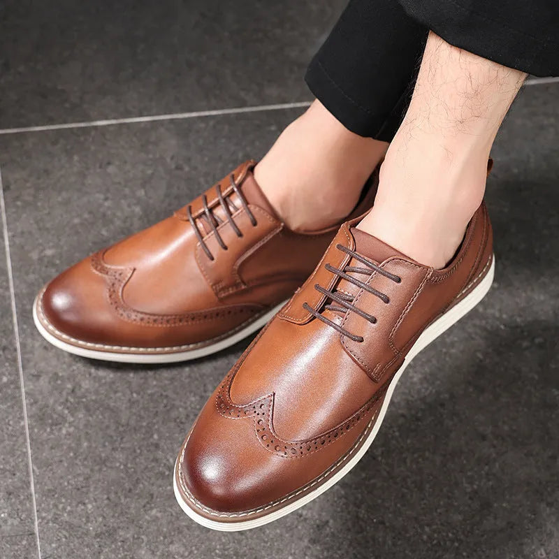 Men's black slip-on casual shoes with round toe and carving design on PU upper