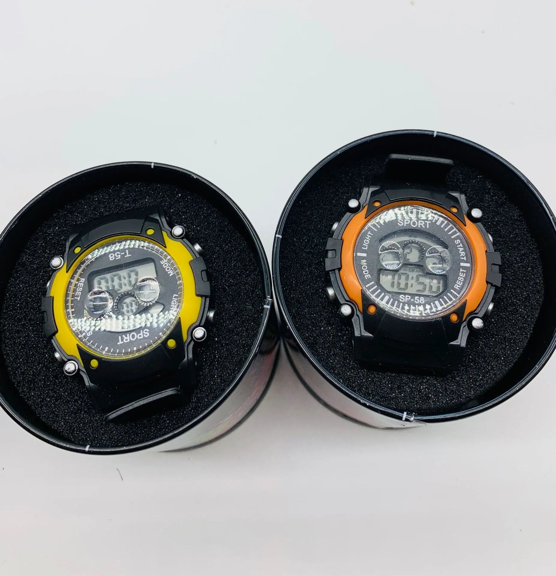 Digital sports watch for students with silicone strap, plastic case, and alarm display