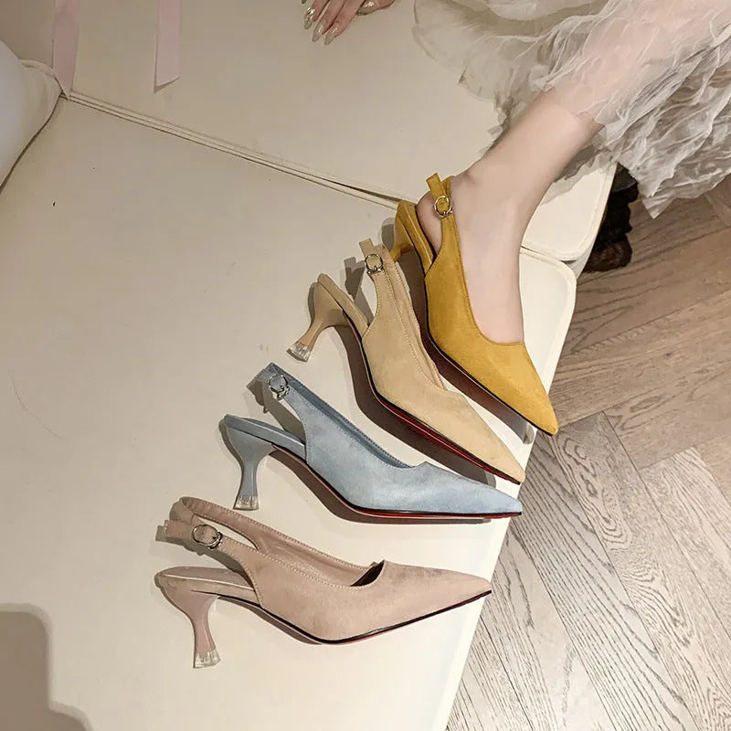 A pair of women's apricot suede stiletto heels with a pointed toe and thin high heel.