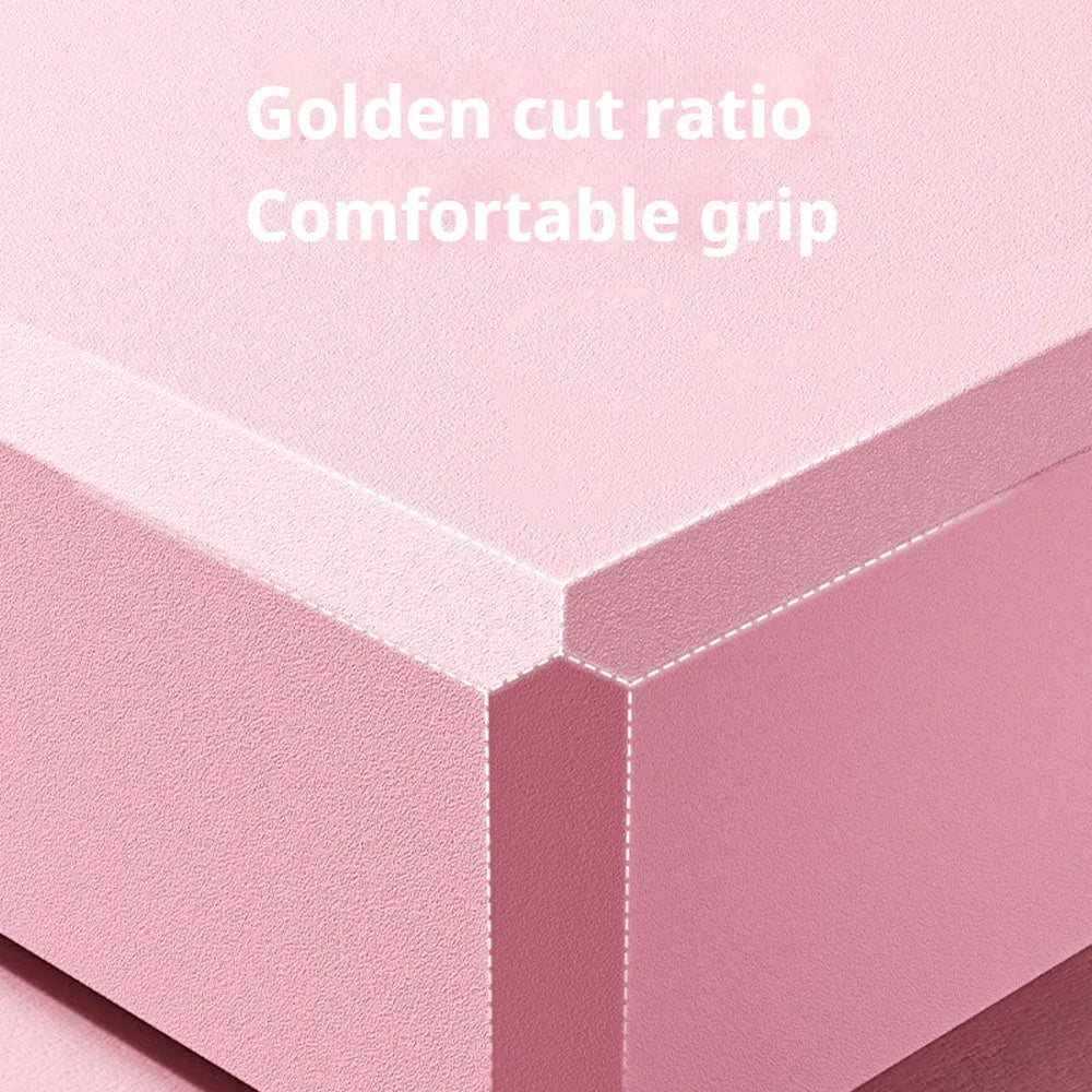Solid colour EVA foam yoga brick block with hexagonal facets for grip, measuring 23x15x7.6cm.