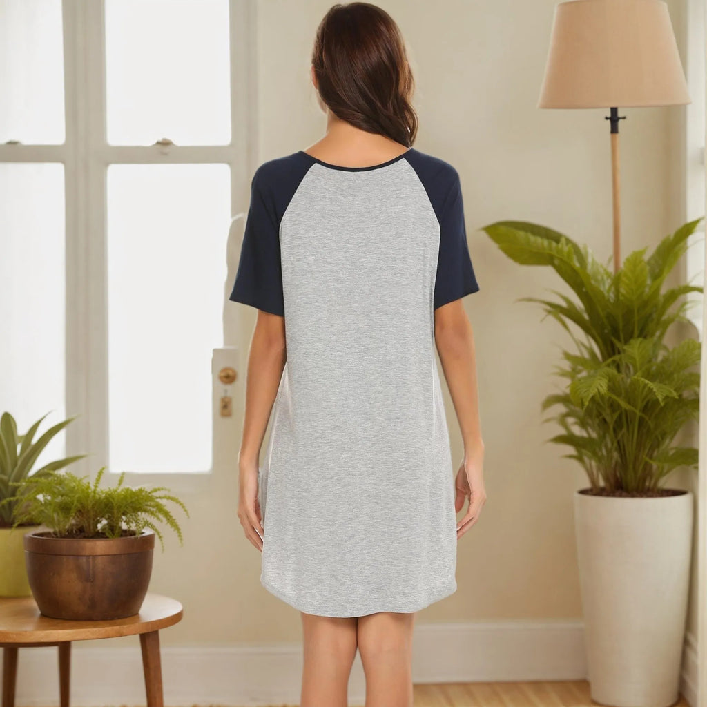 Women's short sleeve nightdress with patchwork contrasting colour sleeves on a hanger.