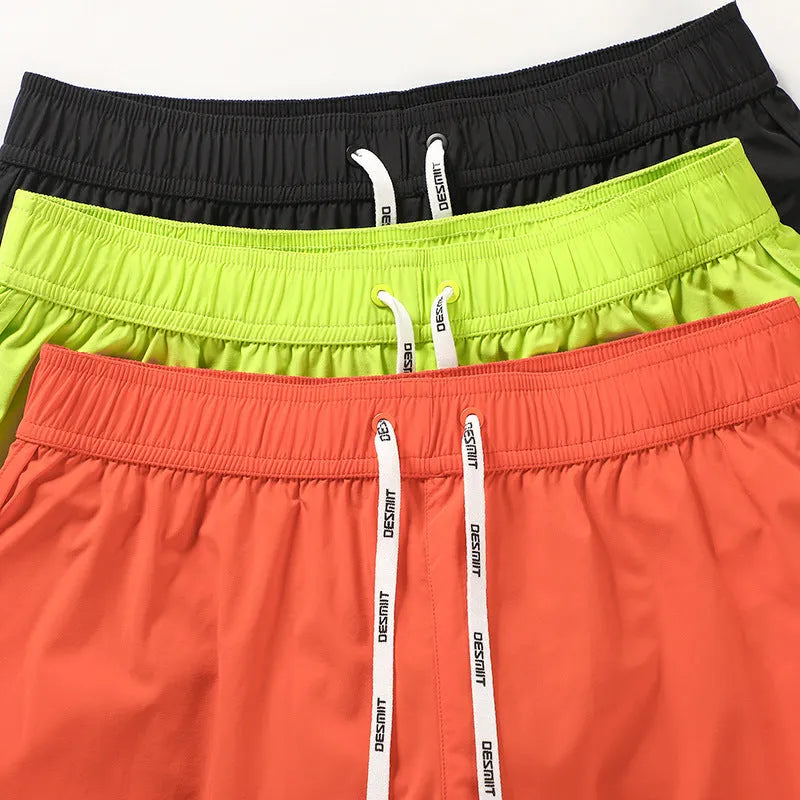 Men's loose-fitting orange polyester beach trousers for surfing and casual summer wear