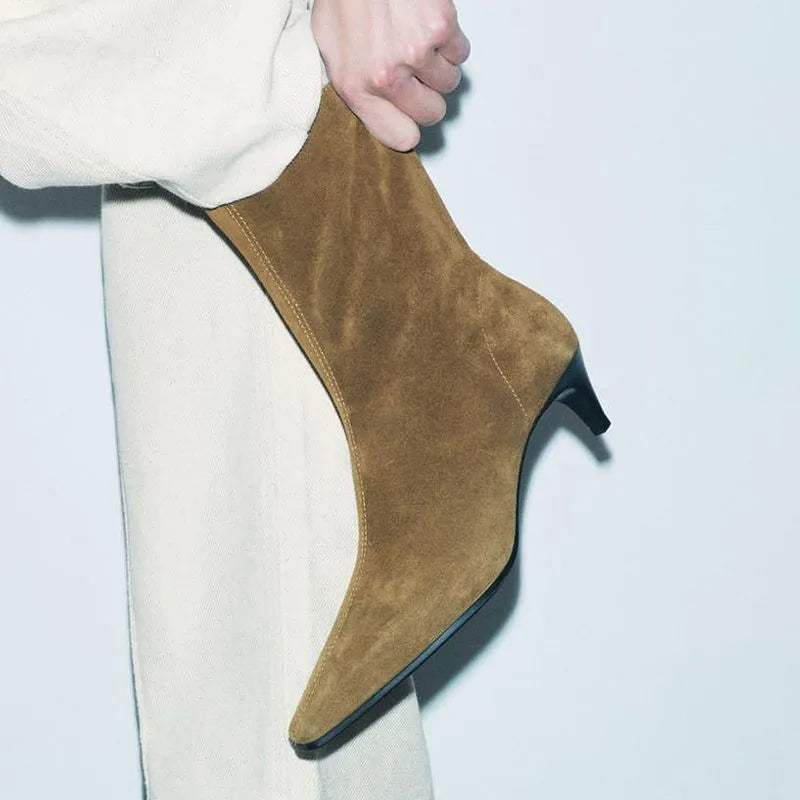 Brown women's square toe ankle boots with a side zipper and a mid-height kitten heel on a waterproof platform.
