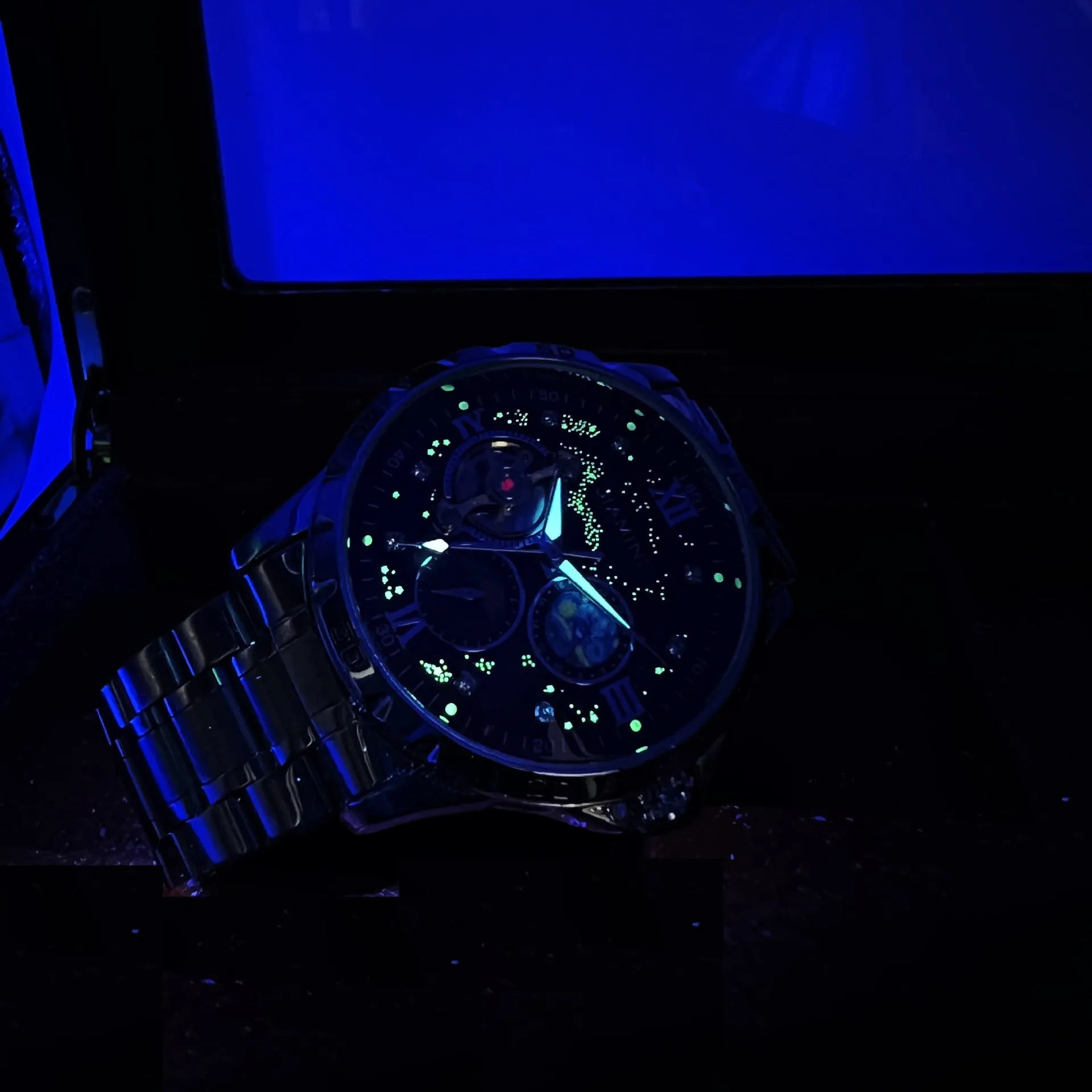 Men's rose gold and black automatic mechanical watch with large dial on wrist