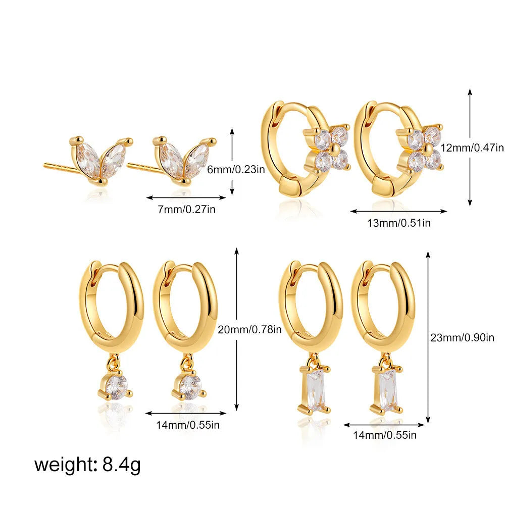 Geometric copper earrings with electroplated gold finish featuring star shapes and zircon detailing