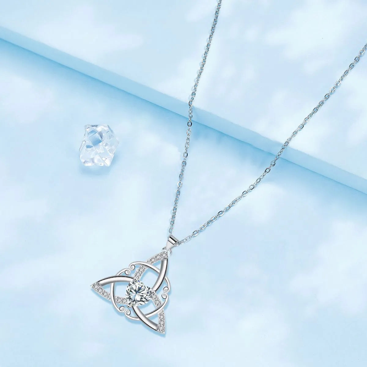 A geometric Celtic knot pendant necklace for women in an electroplated finish.
