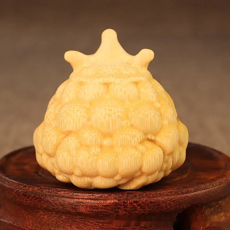Hand-carved bamboo sculpture of a cute Crown Princess toad ornament.