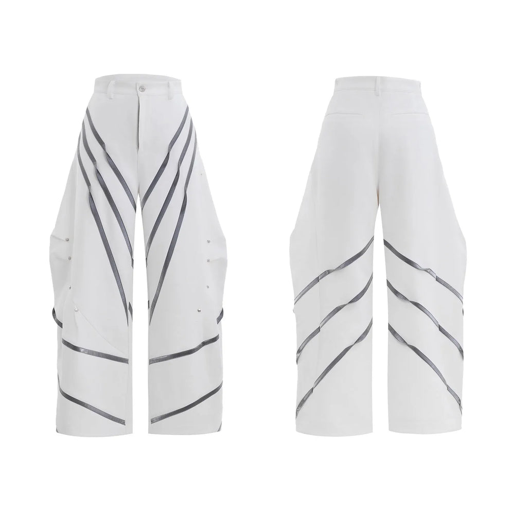 Men's trousers with deconstructed cut, metal striped rivets on pleats, and polyester fabric in black bottom colour
