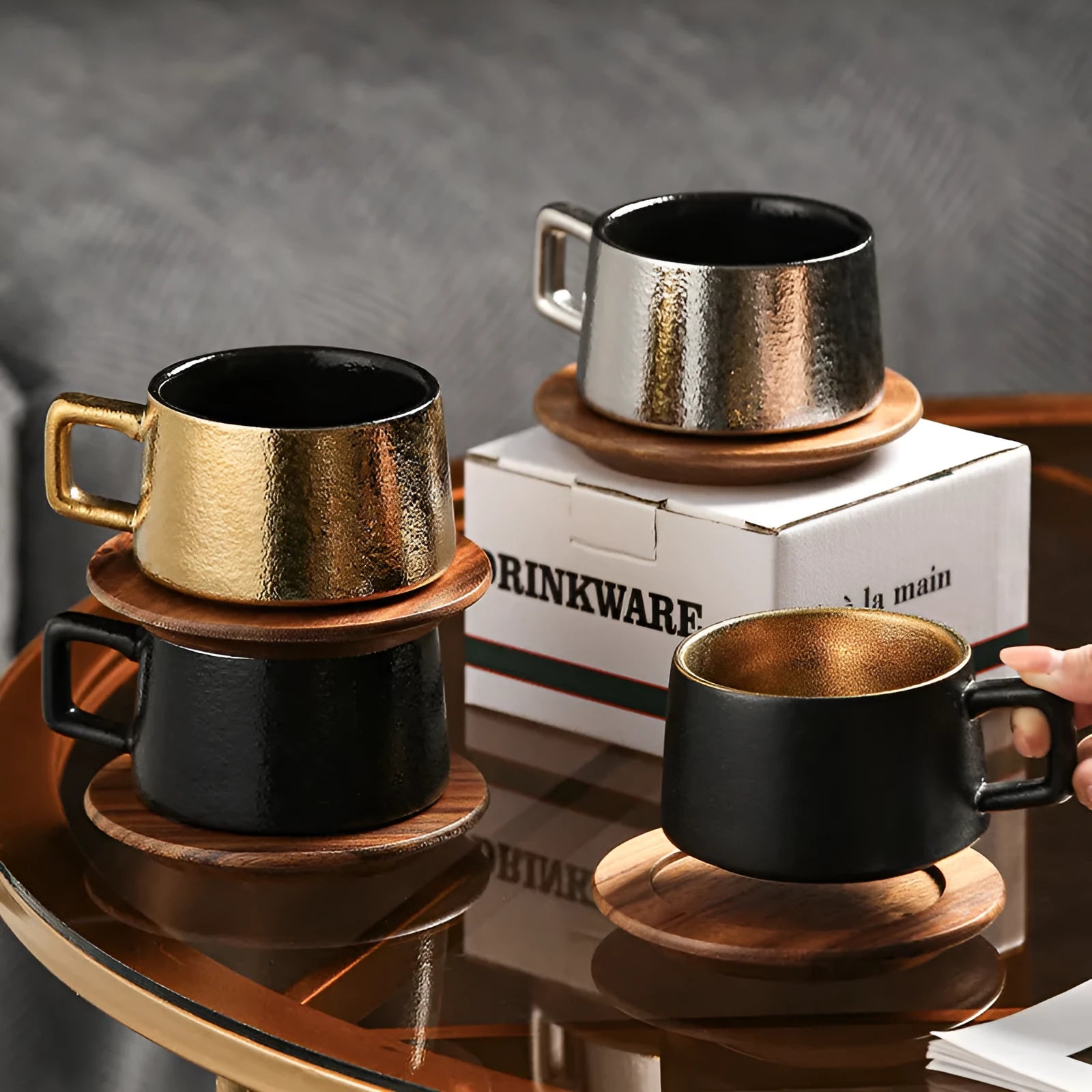 Gold and silver plated gift box next to a 250ml solid colour coffee travel mug.