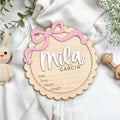 Customised square wooden baby ornament with a name for birthday or holiday decoration.