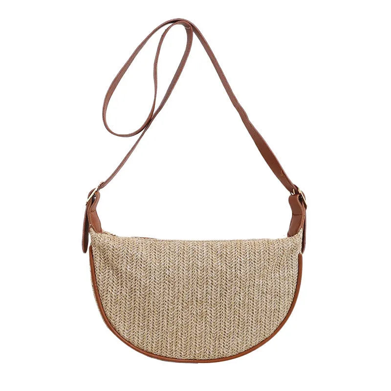 Women's straw woven crossbody bag showing woven texture and internal organisation with phone pocket