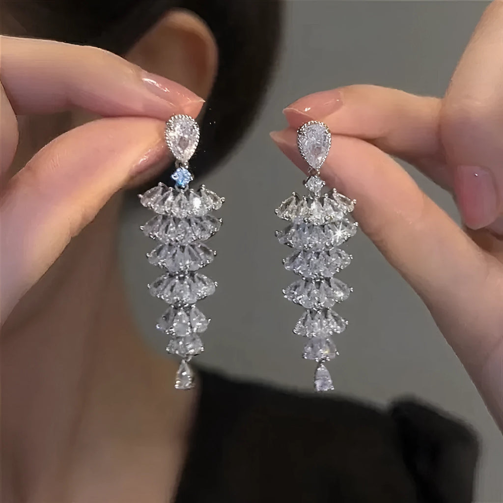 Silver pagoda colour zircon Christmas tree shaped drop dangle earrings on a stud fastening.