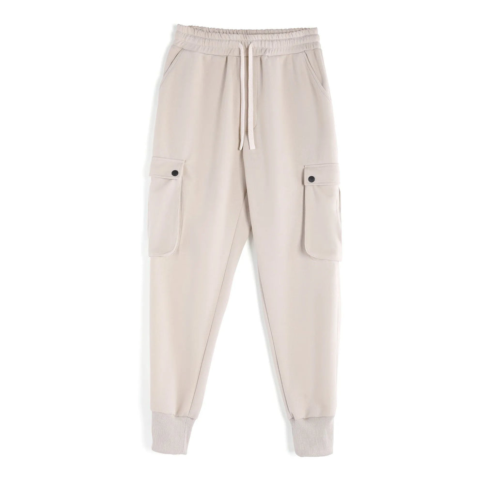 Men's loose cotton trousers with ankle ties and multiple pockets in solid apricot colour