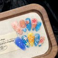 Three-dimensional carved jellyfish plastic wearable armour set in almond nail colour with marine patterns