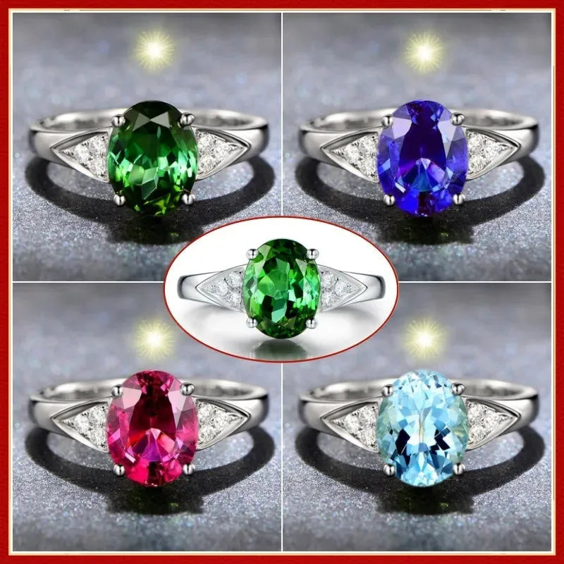 Women's court style zircon ring with heart pattern and blue stone.