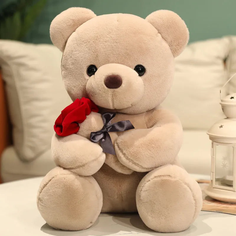 Rose bear plush toy in beige, brown, or grey, shown in sizes from 23cm to 45cm.