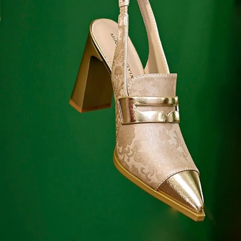 Black pointed toe high heel sandals with a chunky block heel and an elastic ankle strap.