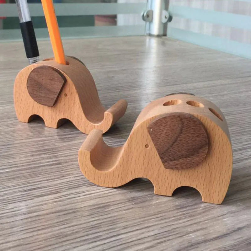 Beech wood mobile phone holder with resin animal decoration and custom lettering on coin back.