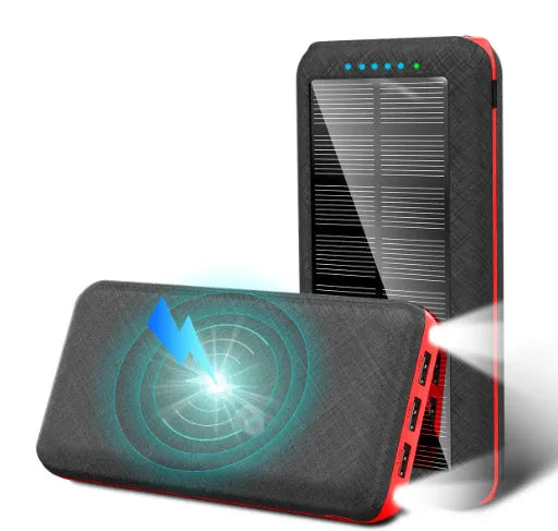 Black portable power bank with Qi wireless charging pad and three USB ports on the side