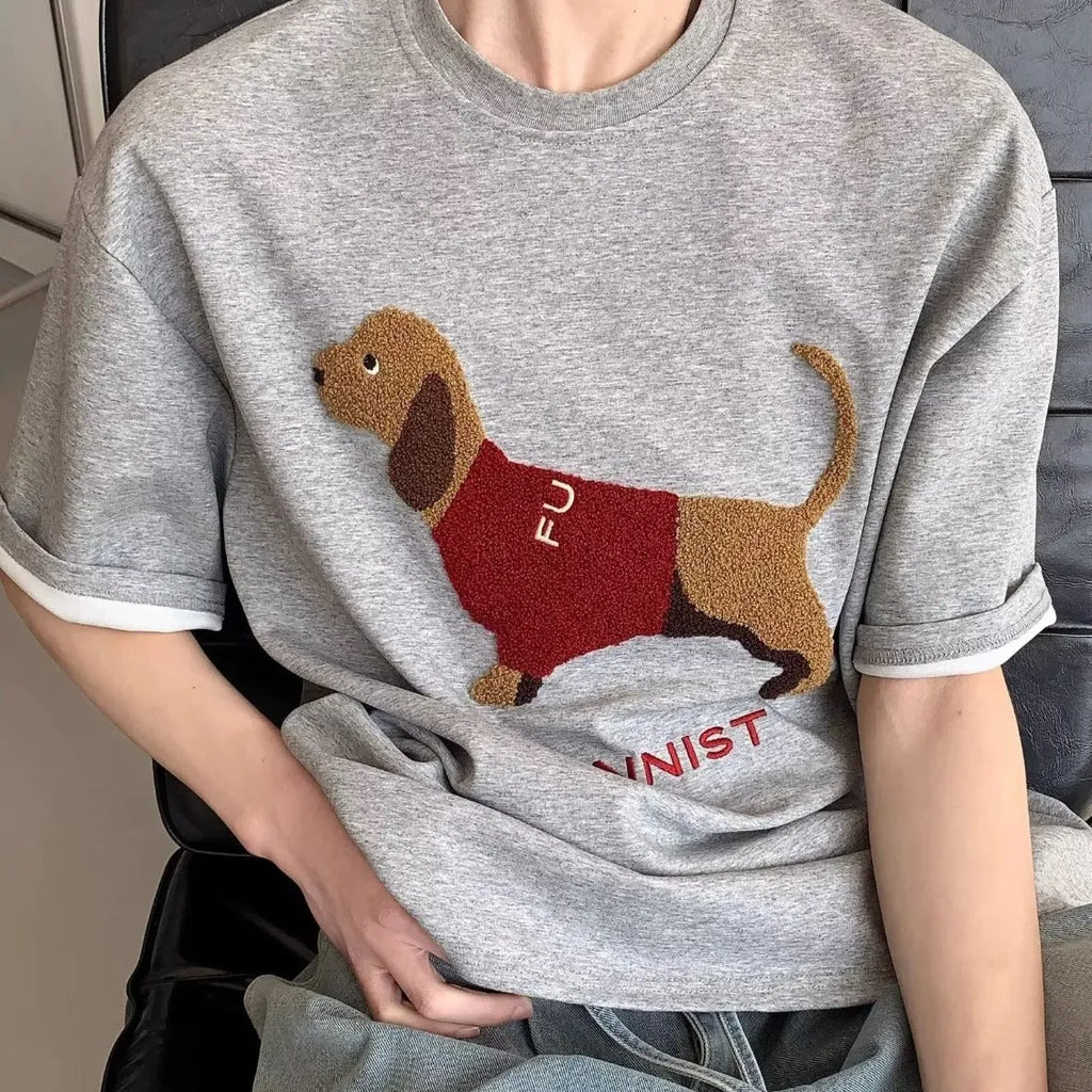 Grey men's t-shirt with an embroidered sausage dog design on the chest