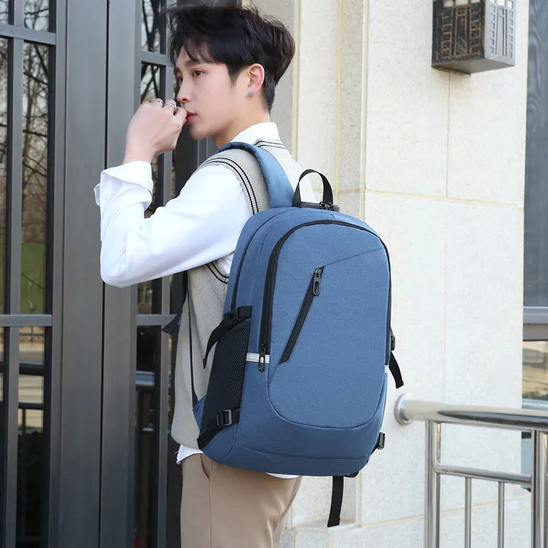 Oxford cloth computer backpack in blue colour showing front storage compartment and adjustable shoulder straps