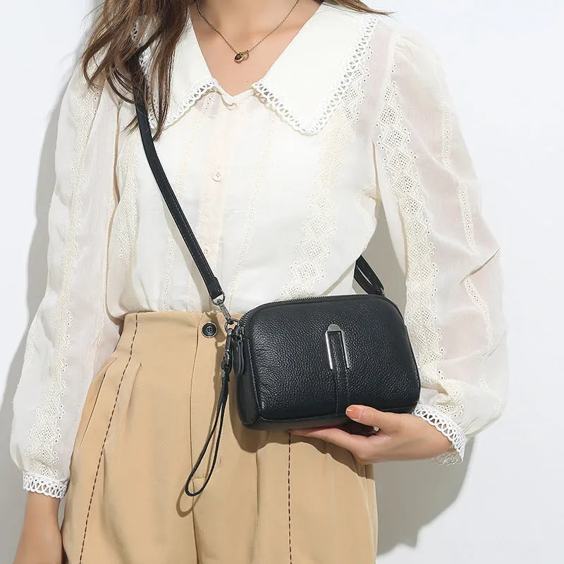 Square genuine leather ladies shoulder bag in dark khaki colour showing structured silhouette.