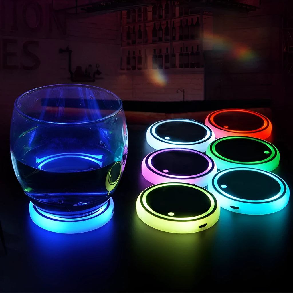 Colourful LED light-up coaster for car cup holder showing multiple light colours on a dark surface.