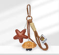 Handmade soda bread creative handbag pendant with baking varnish finish and brown carrying strap