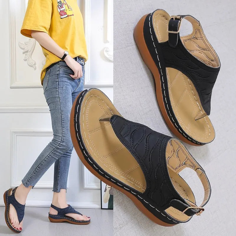 Women's casual wedge-heel sandals with adjustable buckle strap in a solid colour.