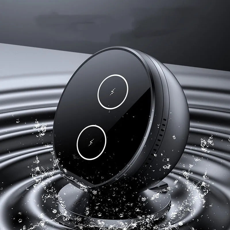 Black ABS plastic wireless phone charger holder with integrated Bluetooth speaker on a wooden desk.
