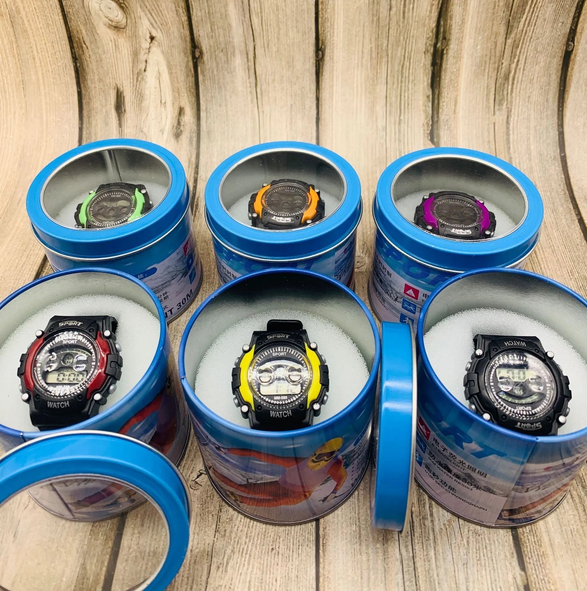Digital sports watch for students with silicone strap, plastic case, and alarm display