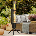 Vertical cast iron wood burning rocket furnace stove for outdoor patio and courtyard heating.