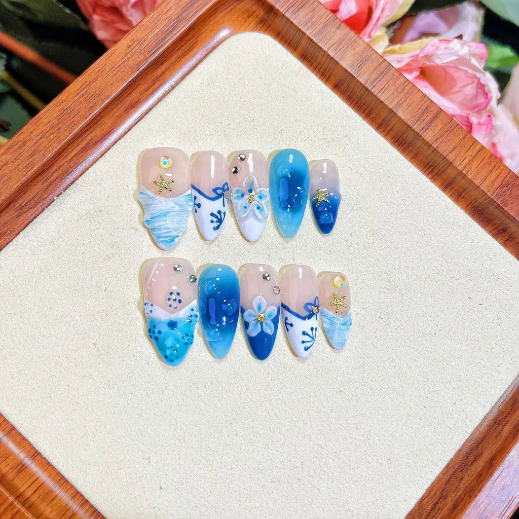 Blue hand-painted carved summer ice transparent plastic fake nails in four sizes XS S M L
