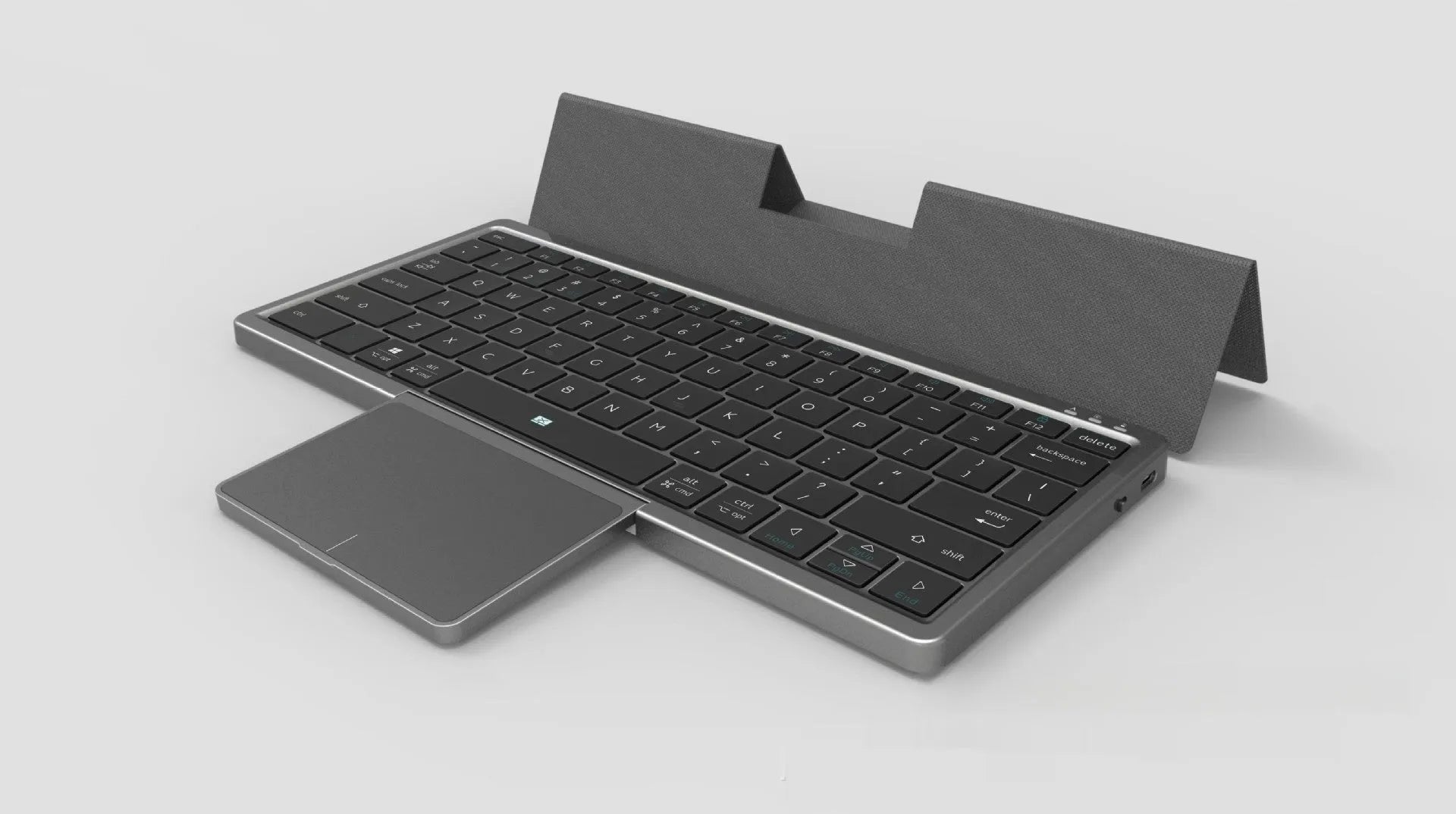 Black and grey hardcover wireless Bluetooth keyboard with integrated touch pad and stand for iPad and mobile phones.