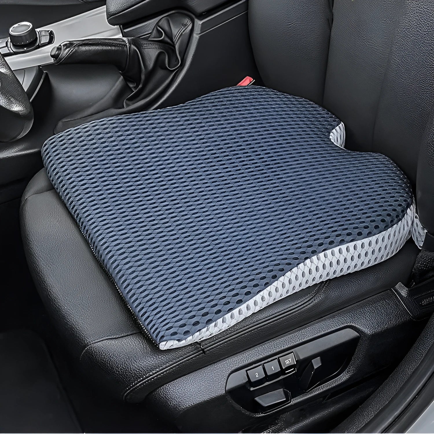 Memory foam car seat cushion with adjustable strap in black, grey and creamy white colours.