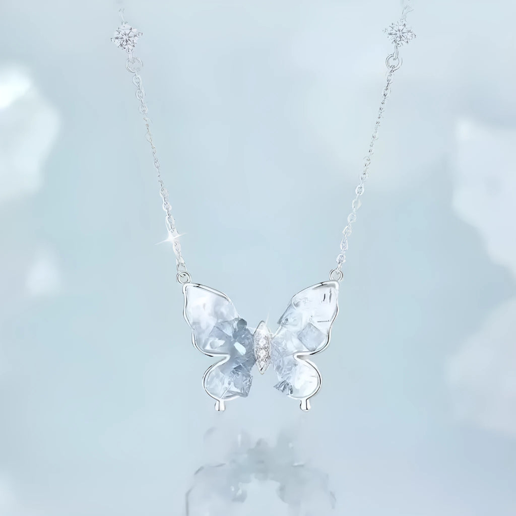 Close-up of a silver butterfly pendant necklace on an adjustable O-ring chain.